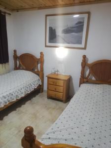 Łóżko lub łóżka w pokoju w obiekcie Casa ecologica, autosuficiente en Lomo Blanco, dentro de una casa rodeada de naturaleza