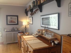 a kitchen with wooden cabinets and a counter top at Carragh House in Castlebar