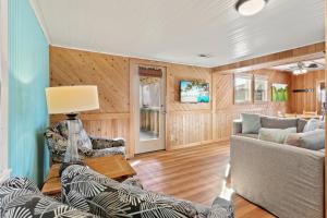 a living room with a couch and a table at 7147 - Geri's Place #11A in Wanchese +17 photos