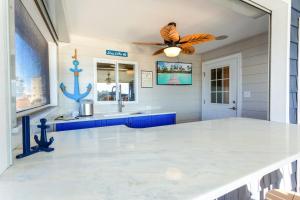 a bathroom with a butterfly on the ceiling at 5062 - Our Bright Idea in Kill Devil Hills
