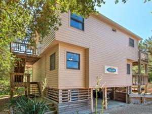a tiny house with a wrap around porch at 3041 - The Beach House in Southern Shores