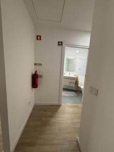 an empty room with a hallway with a bathroom at Alojamento Alto da Lixa in Freixo de Cima +9 photos