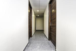 an empty corridor with a door at Hotel O J2 Service Apartment in Chennai
