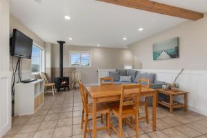 a living room with a table and a couch at SEA ESTA on WHIDBEY ISLAND in Maxwelton