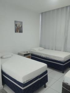 Ένα ή περισσότερα κρεβάτια σε δωμάτιο στο Pousada Alameda Boa Vista +37 φωτογραφίες