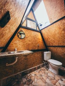 a bathroom with a toilet and a sink with a window at Tepuy Hostel in Boa Vista +86 photos