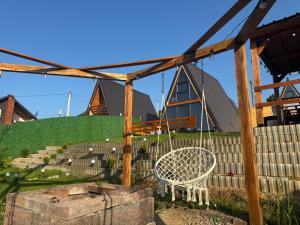 a swing in the yard of a house at Villa Roi in Ferizaj