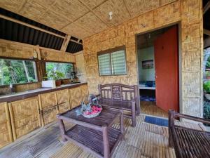a room with a table and two chairs and a kitchen at Cliff Haven Homestay in San Francisco