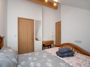 Ένα ή περισσότερα κρεβάτια σε δωμάτιο στο Candles Cottage +11 φωτογραφίες