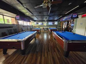 a billiard room with two pool tables in it at Stay Inn - Bartow in Bartow