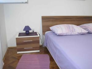 Łóżko lub łóżka w pokoju w obiekcie Apartment in Zadar - Zadar Riviera 7970