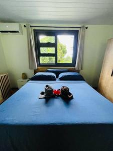 Voodi või voodid majutusasutuse Moana Lodge toas