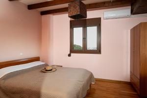 Postel nebo postele na pokoji v ubytování Verano Family House