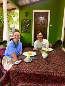 a man and a woman sitting at a table at Green Bamboo House in Sigiriya +31 photos