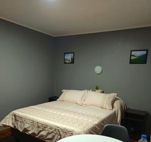 Cama o camas de una habitación en Lodge Atacama Hostal