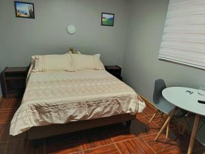 Cama o camas de una habitación en Lodge Atacama Hostal
