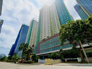 a group of tall buildings in a city at 1205T2 Avida Riala IT Park 1BR Unit 400Mbps Internet in Cebu City