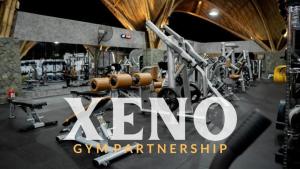 a gym with a bunch of equipment in a room at Nomada Villas - Giant Pool - Private Kitchen - Free Gym Access - Up to 40Mbps WiFi in Kuta Lombok +20 photos