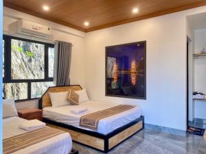 Katil atau katil-katil dalam bilik di Bamboo Riverside Homestay