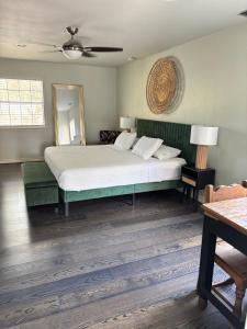 a bedroom with a large bed and a fan at Best location in McAllen pool perfect for groups in McAllen +15 photos