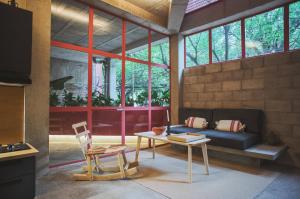 a living room with a couch and a table at Xolo Condesa in Mexico City