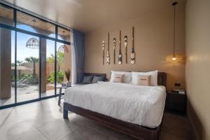a bedroom with a bed and a large window at The Wood Terrace in Ban Chin Tham Mai +56 photos