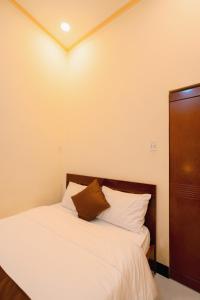 Postel nebo postele na pokoji v ubytování APT Hotel Phan Rang