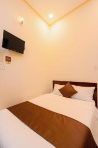 Postel nebo postele na pokoji v ubytování APT Hotel Phan Rang