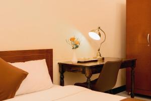 Postel nebo postele na pokoji v ubytování APT Hotel Phan Rang
