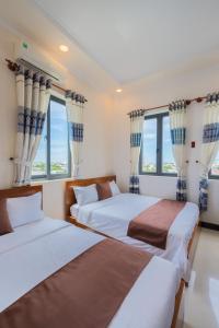 Postel nebo postele na pokoji v ubytování APT Hotel Phan Rang