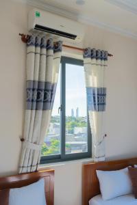 Postel nebo postele na pokoji v ubytování APT Hotel Phan Rang
