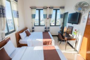 TV a/nebo společenská místnost v ubytování APT Hotel Phan Rang