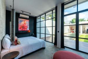 Ένα ή περισσότερα κρεβάτια σε δωμάτιο στο Rouge - Loft Cinta