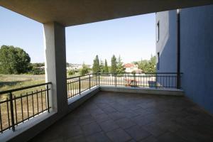 a balcony with a view of a field at Hotel Marant in Sozopol
