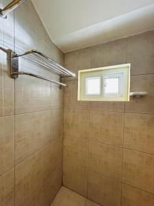 a bathroom with a shower and a window at Sheridan Villas Boracay in Boracay +68 photos