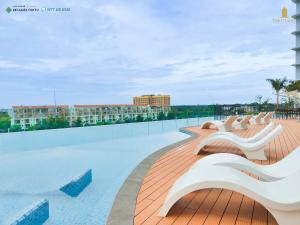 a row of benches on the roof of a building at Homie's The Glory Apartment in Thu Dau Mot