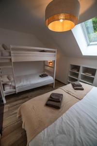 Postel nebo postele na pokoji v ubytování Gîte Nordik Fagne