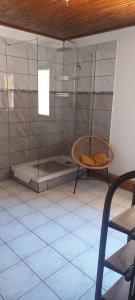a shower with a glass door in a room at La Maison de Charlie Les 2 Alpes in Les Deux Alpes +58 photos