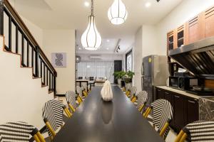 a conference room with a long table and chairs at Nimman Nest AndLae Living in Chiang Mai +64 photos