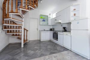 Kuchyň nebo kuchyňský kout v ubytování Holiday Home Platanus