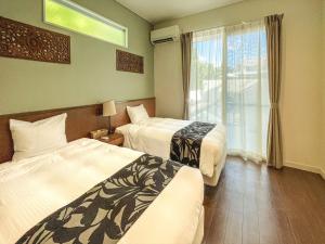 Voodi või voodid majutusasutuse Ahman Suite Villa Sumuide toas