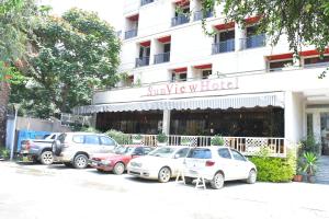 a group of cars parked in front of a hotel at Sun View Hotel in Addis Ababa