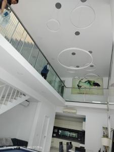 a person walking down a staircase in a building at ปาล์มสปริง by Nimo villa pattaya in Ban Nong Pru