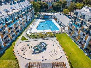 an overhead view of a swimming pool in a building at SEA & SMILE APARTMENT - BASEN, SAUNA, PARKING, WIFI, SPA Kołobrzeg Podczele in Kołobrzeg