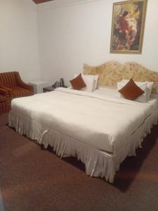 Krevet ili kreveti u jedinici u okviru objekta Tea Bush Hotel