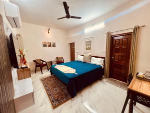 Ένα ή περισσότερα κρεβάτια σε δωμάτιο στο Matrika Homestay +5 φωτογραφίες