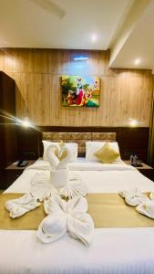 Ένα ή περισσότερα κρεβάτια σε δωμάτιο στο THE CLAN HOTEL - VIJAY NAGAR Indore