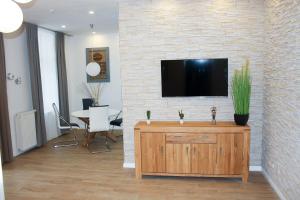 TV a/nebo společenská místnost v ubytování Ferienwohnung im Ostseebad Göhren in Strandnähe, Kurhaus Nordstrand,Nähe Binz und Sellin + 24 fotografií