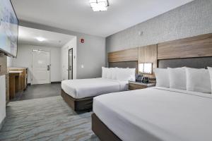 The Penn Stroud, Stroudsburg - Poconos, Ascend Hotel Collection客房内的一张或多张床位