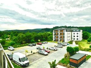 an aerial view of a parking lot with cars at Kierunek Bieszczady in Lesko